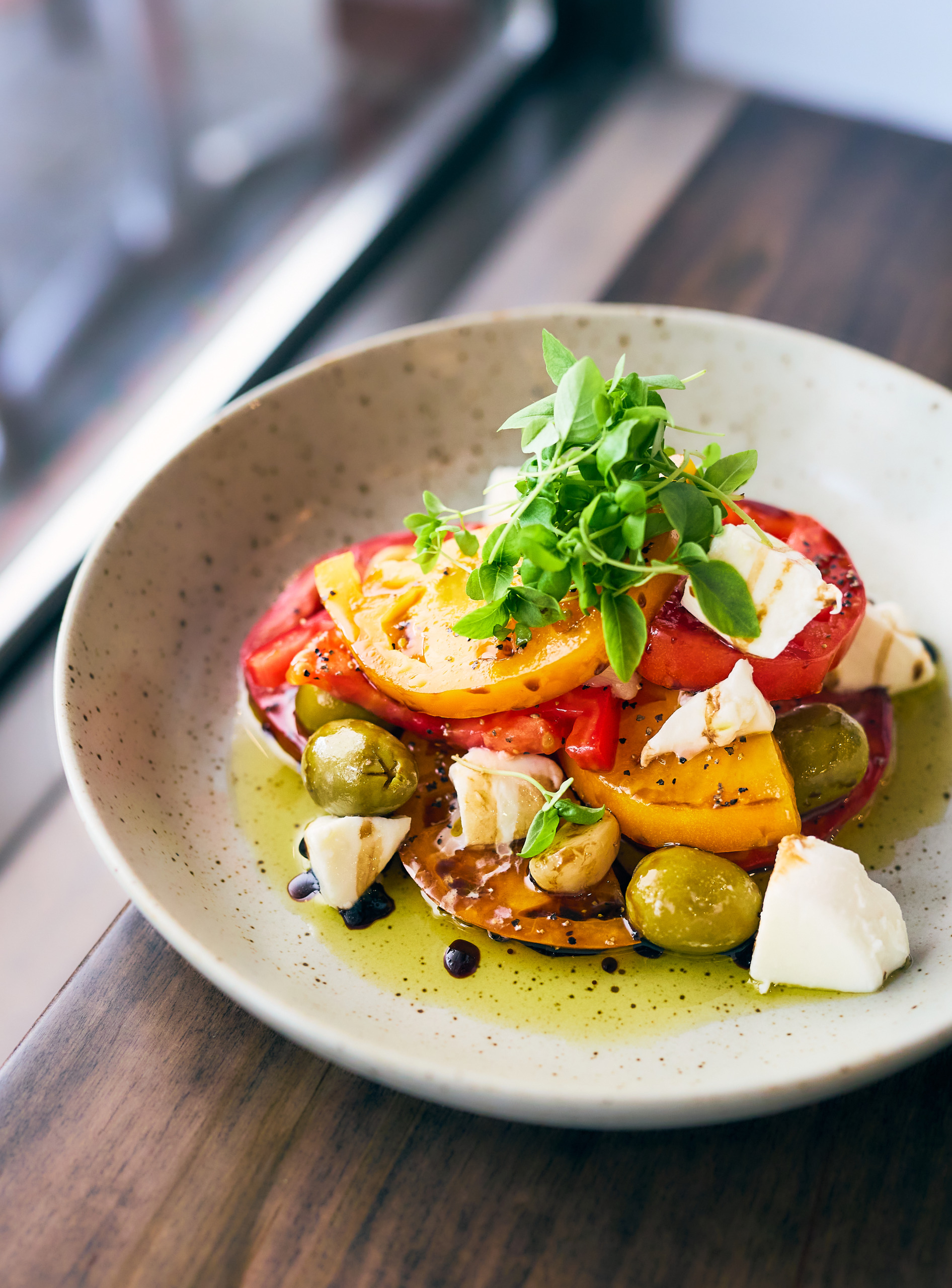 Local tomatoes and cheese plate with olives from The Urban Pantry