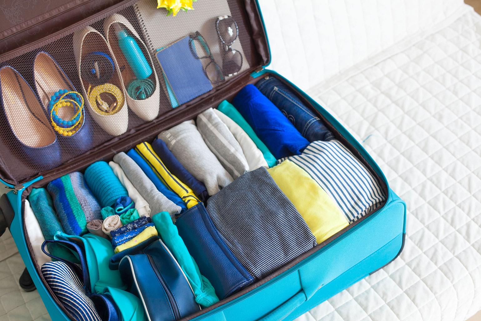 Resultado de imagen para rolled clothes in suitcase