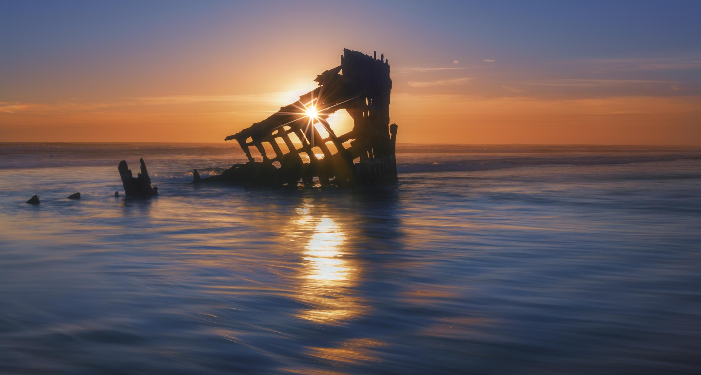 The remains of the Peter Iredale, a four-master ship that ran aground in 1906, at low tide in Fort Stevens State Park.