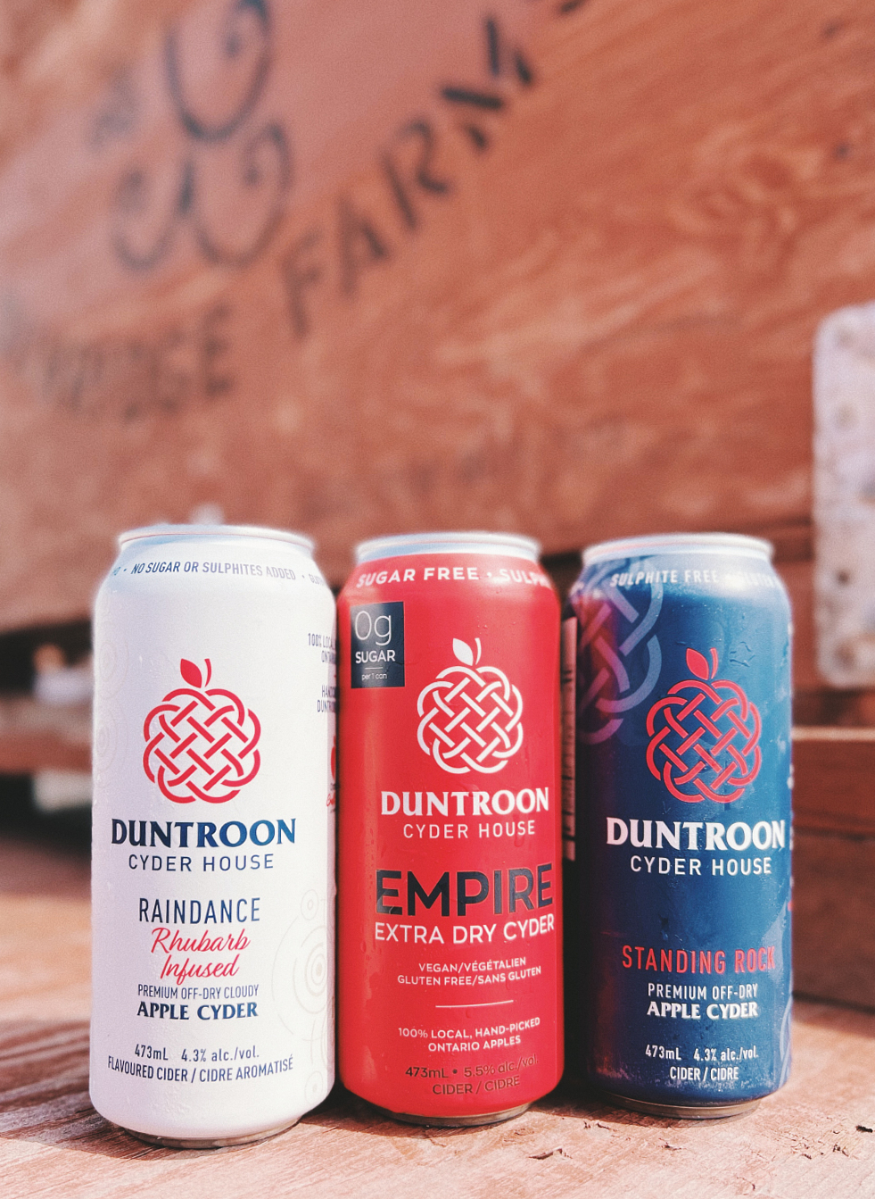 White, red and blue cans of Duntroon cider