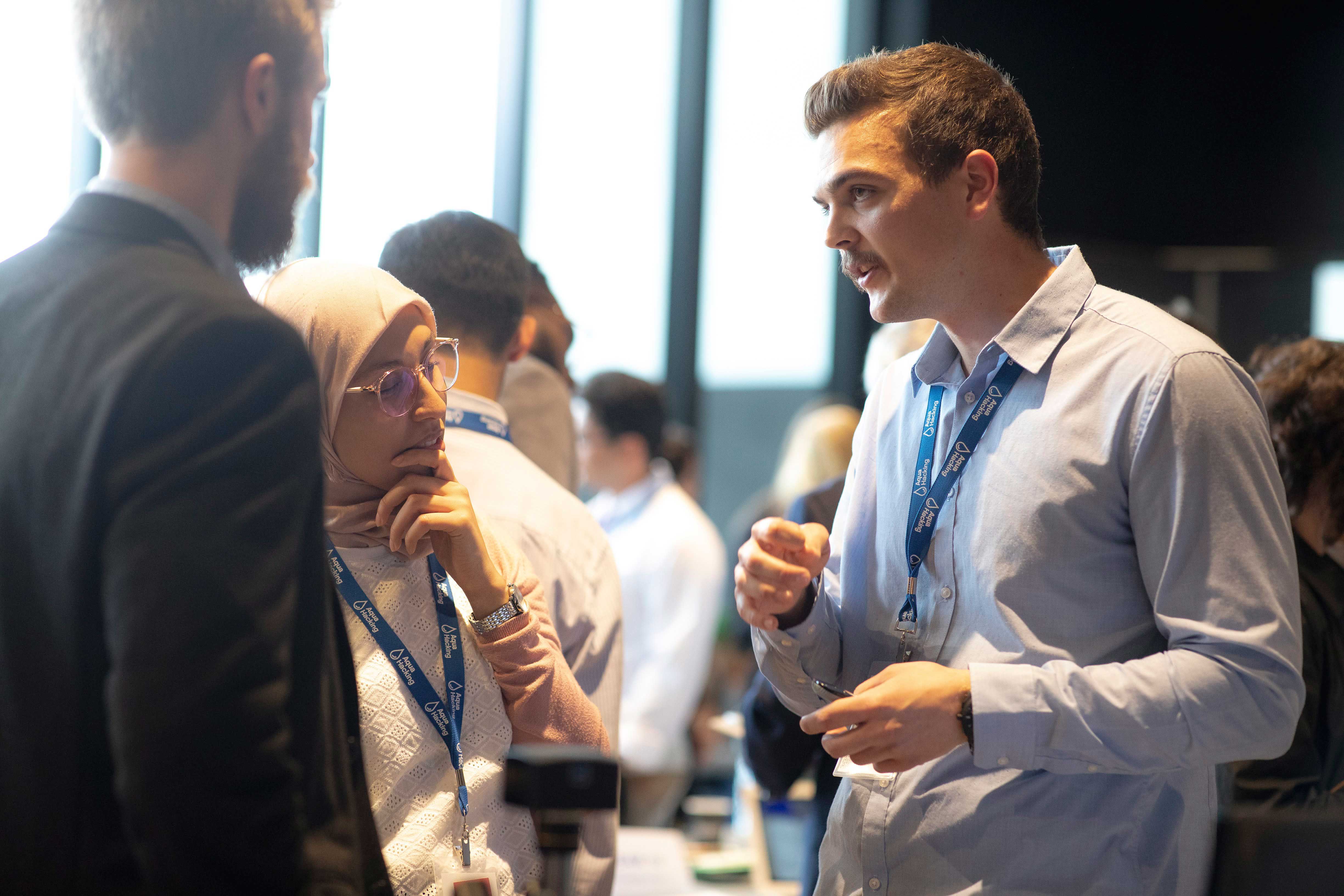 Group of young people networking at the Aquahacking event