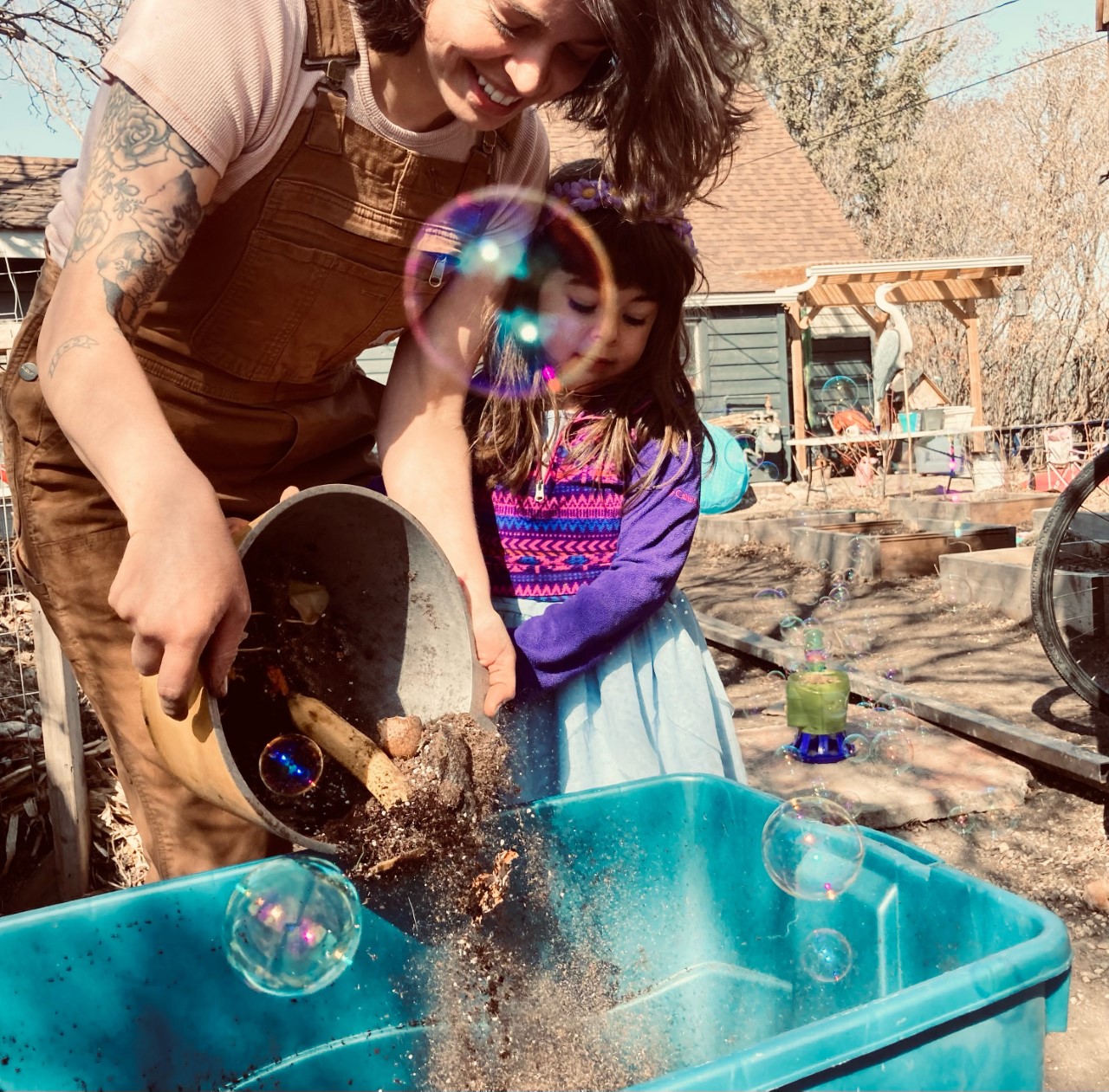 A photo of Miranda Holt working at her business, Better Earth Worms. 