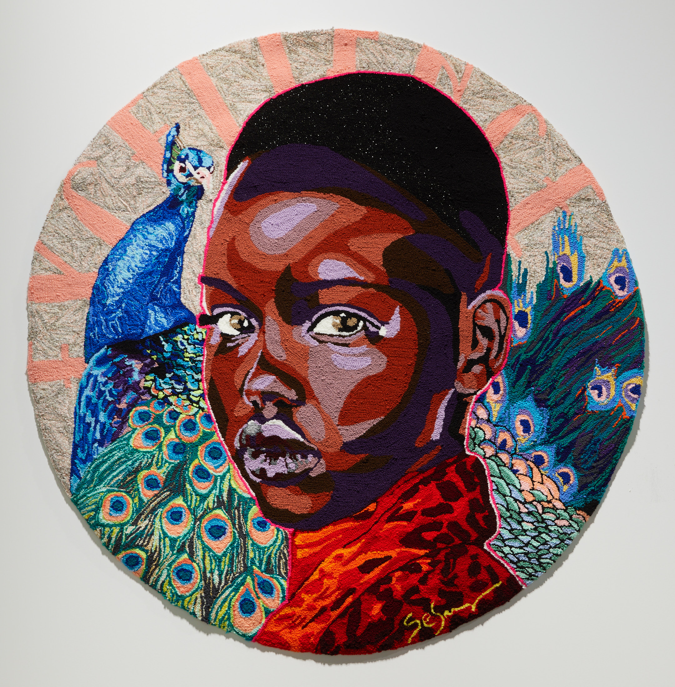 Tapestry of a young black child in front of a peacock.