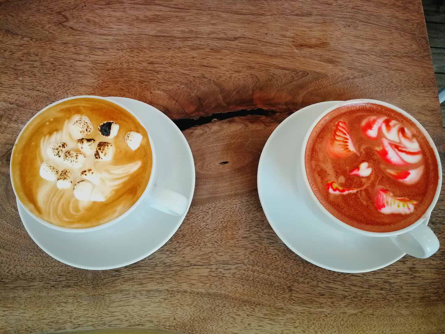 Coloured latte and Campfire latte served at Versus Coffee.
