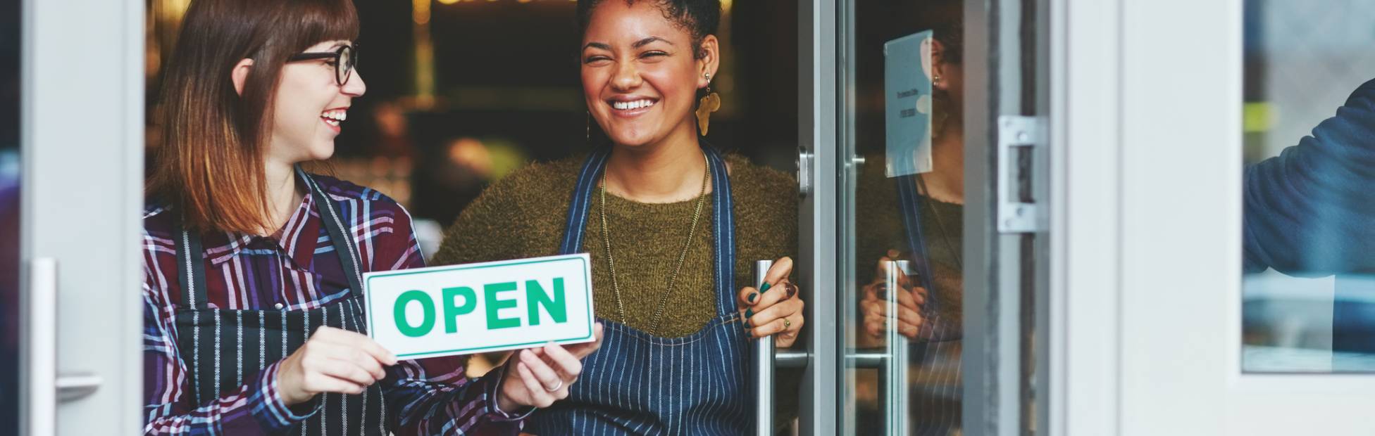 2 store owners opening their store