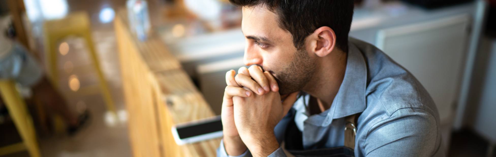Pensive male business owner