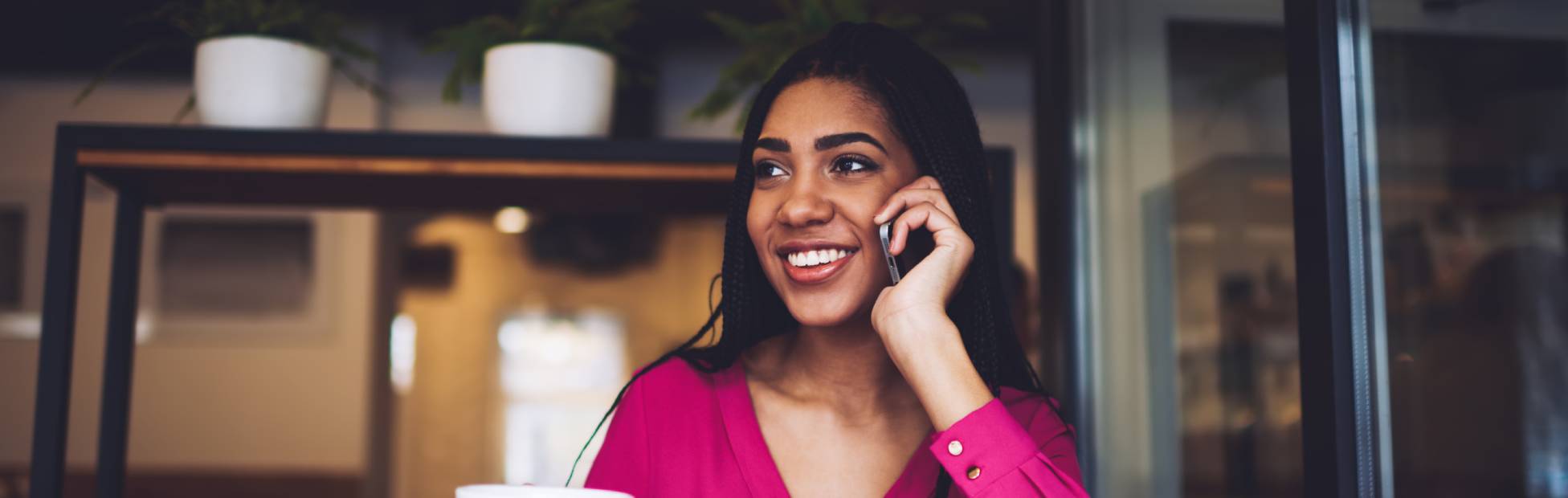 Female on the phone, coffee shop