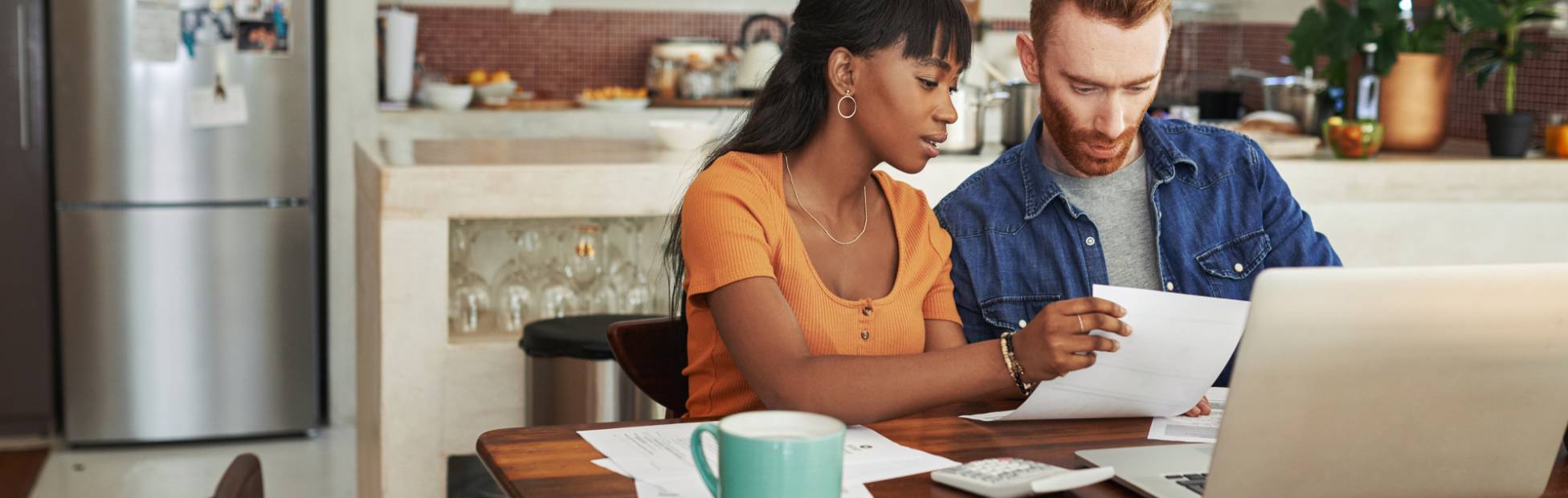 A couple reviewing bills.