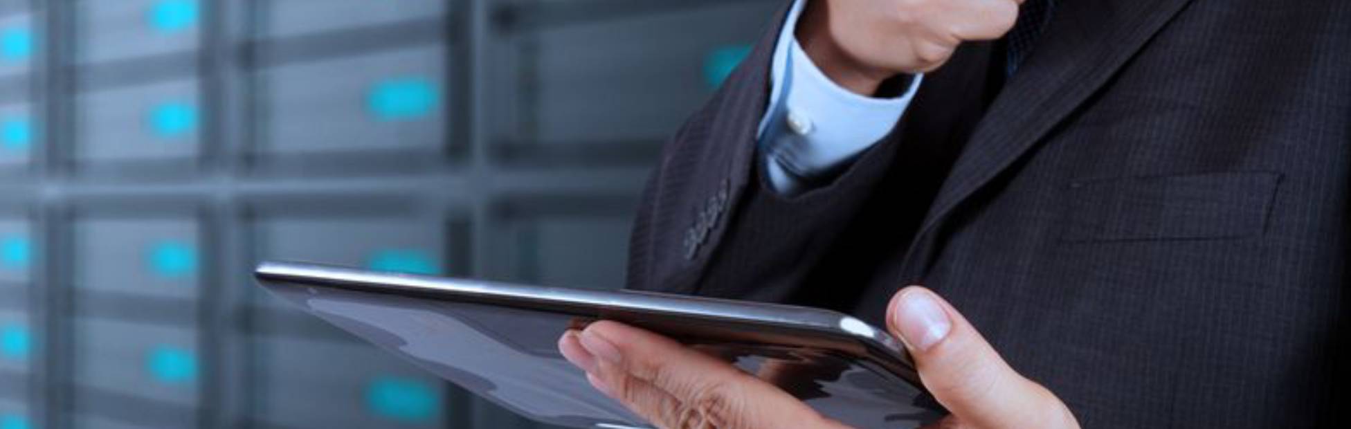 Man in suit holding tablet