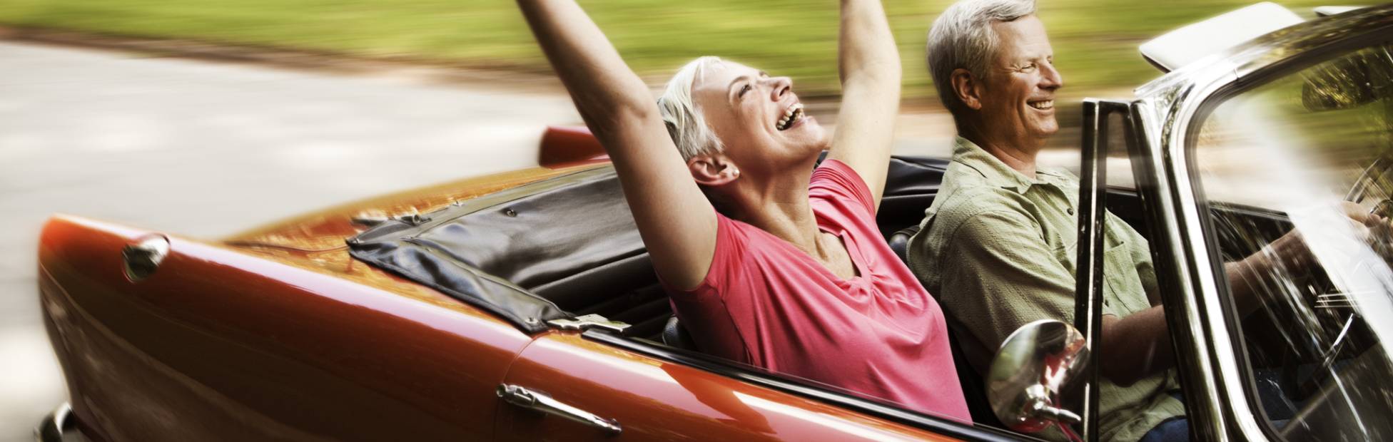 Couple riding in a convertible