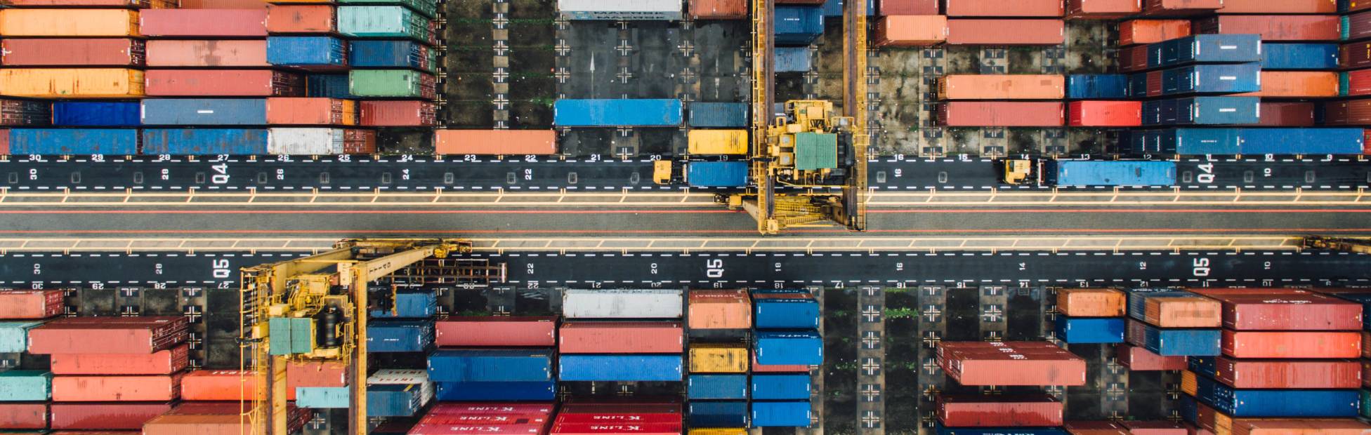 Arial photo of shipping containers representing supply chains