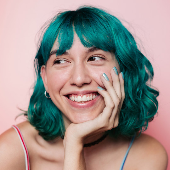 Lady with green hair smiling