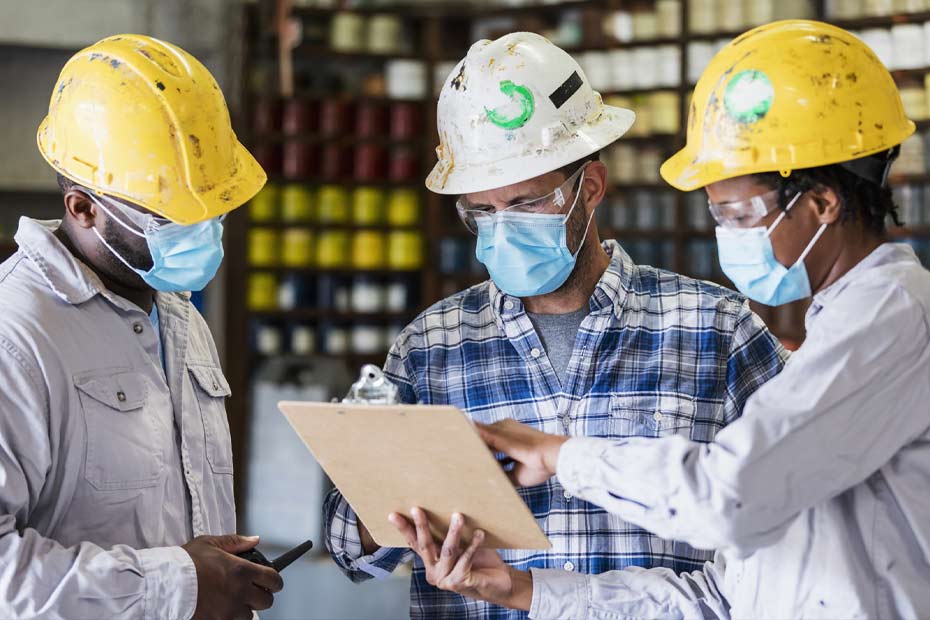 Business owner with staff in warehouse