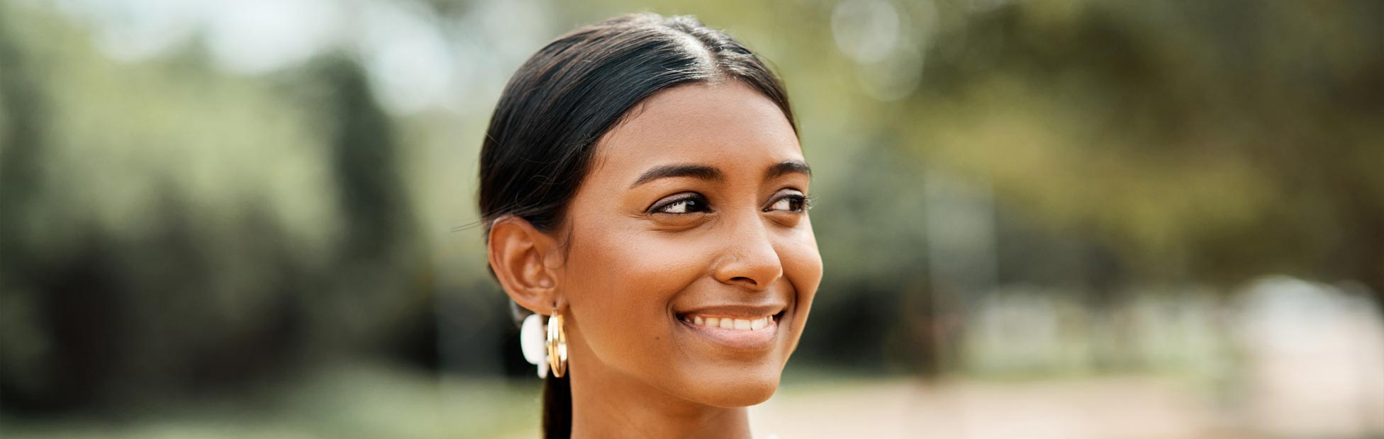 Cropped portrait shot of an attractive young female student on outside campus