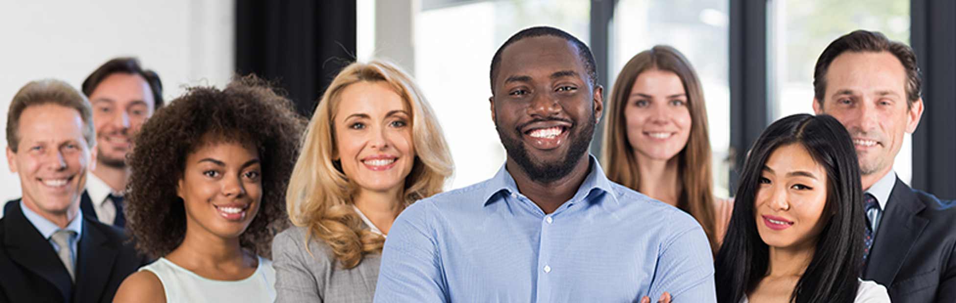 A diverse group of coworkers standing together