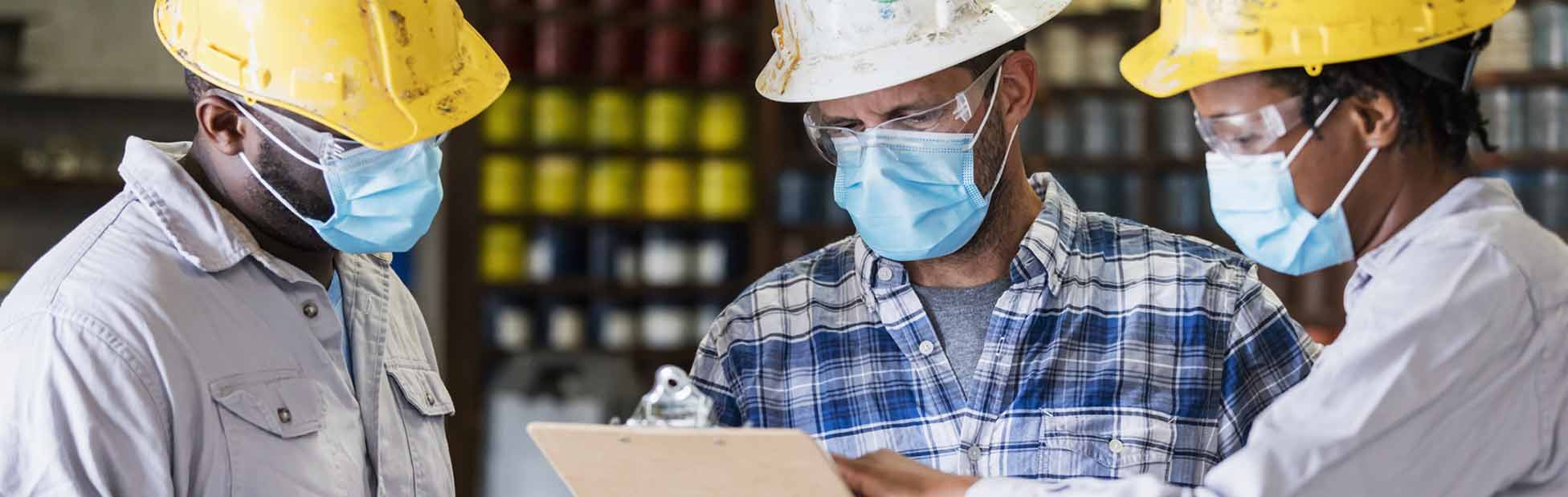 Business owner with staff in warehouse