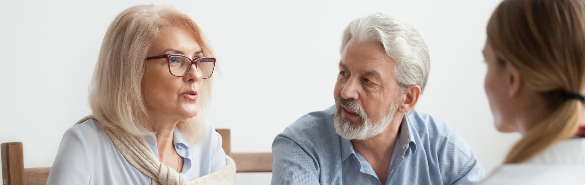 Older couple speaking with an advisor about renovation plans