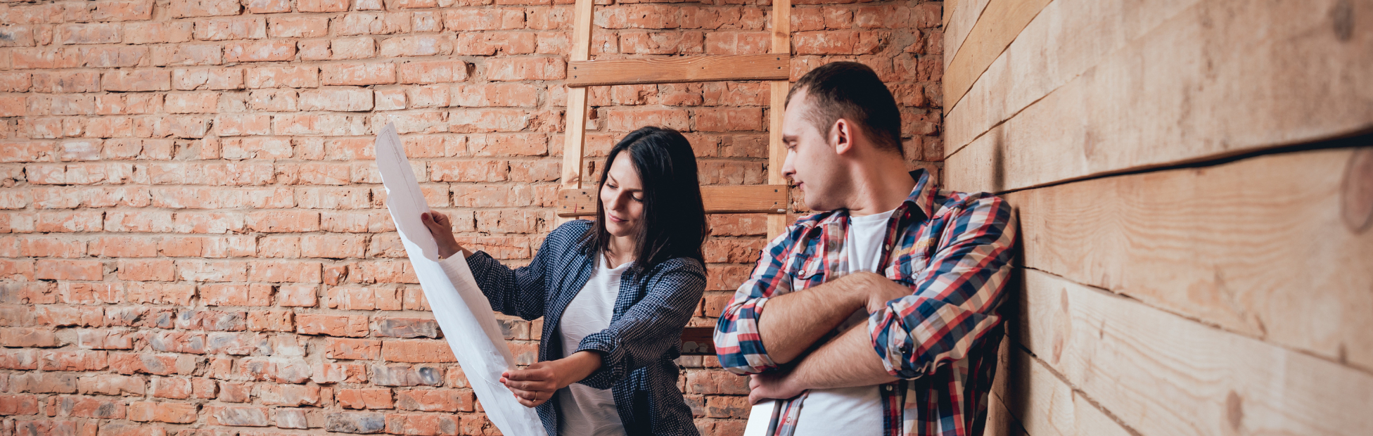 Happy couple designing Home Renovations