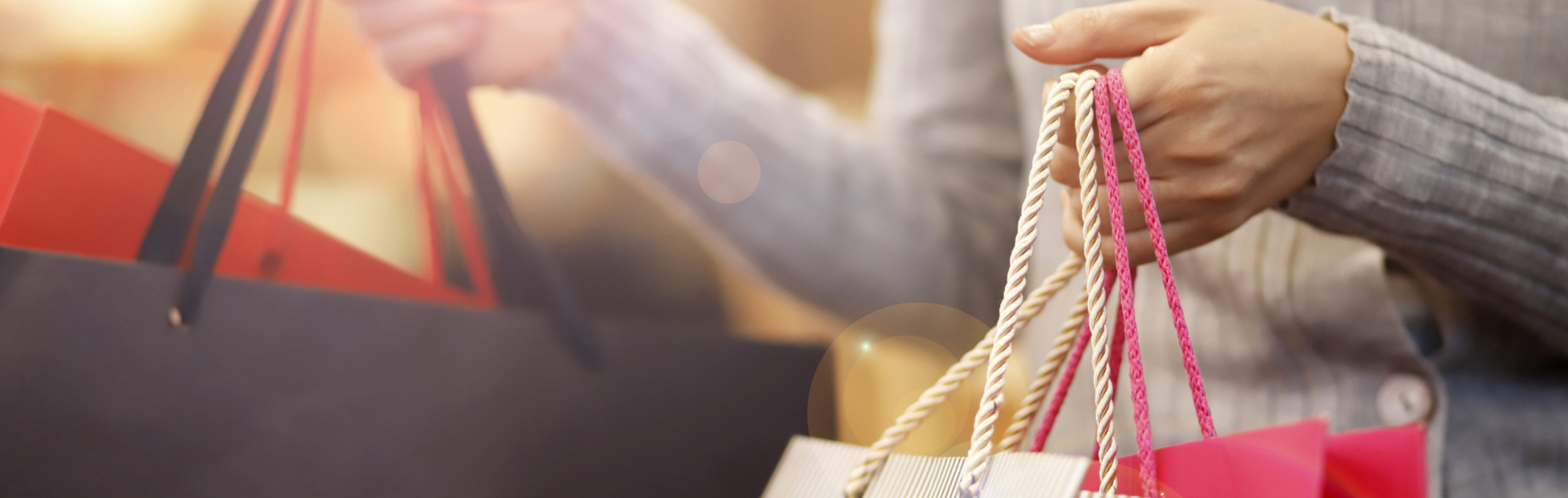 Close up of a woman carrying shopping bags