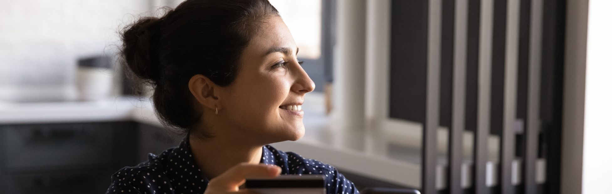 Smiling young Indian female woman shopping online