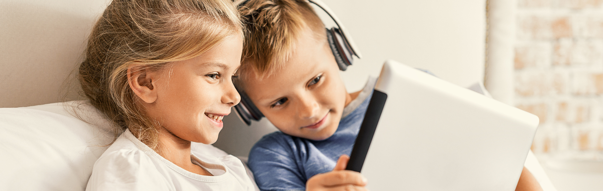 2 kids on mobile device