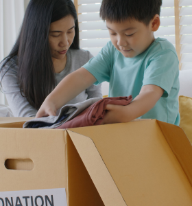 Mother and son making donation box