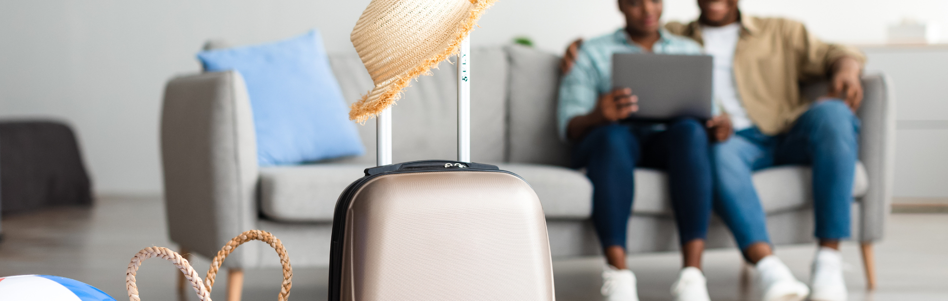 African American couple on Vacation Using Laptop to do banking