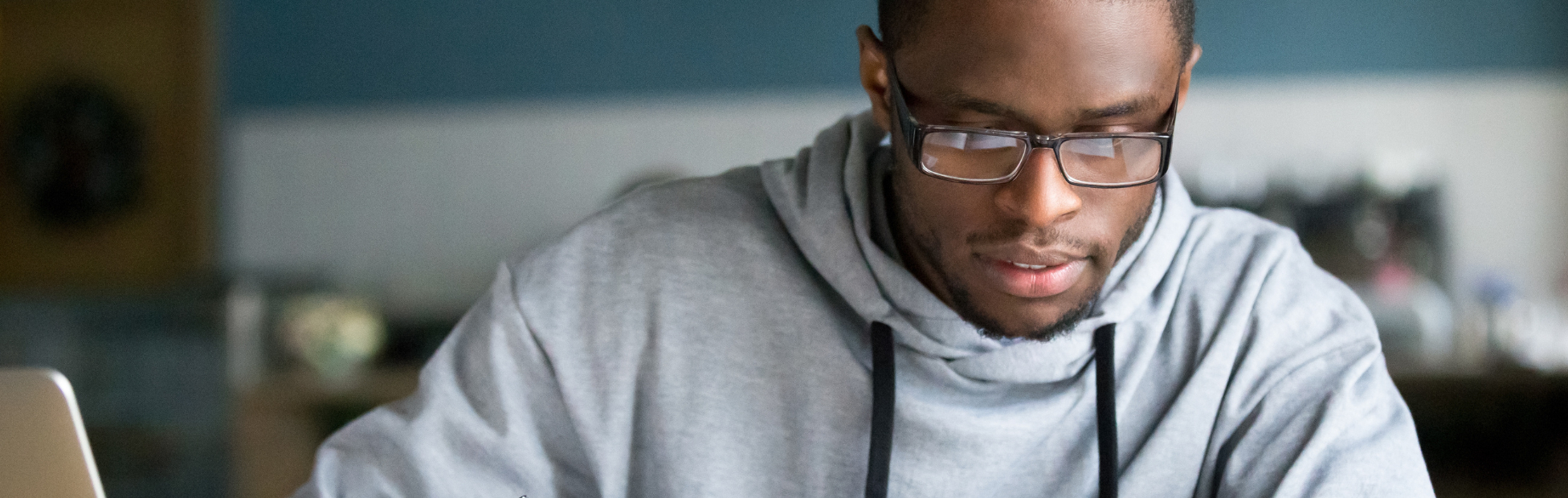 Young African American man studying in the University Library