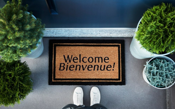 Welcome mat at the front door of a house.
