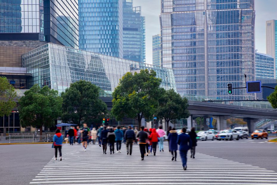 A group of pedestrians crossing the street in downtown Shanghai
