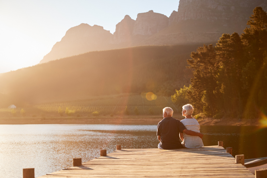 Senior couple sitting by the pier