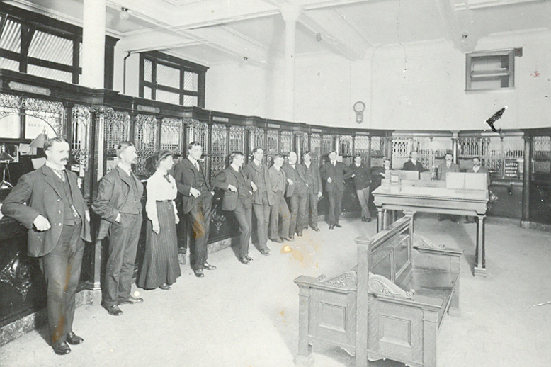 Employees lined up inside RBC Vancouver main branch in 1904