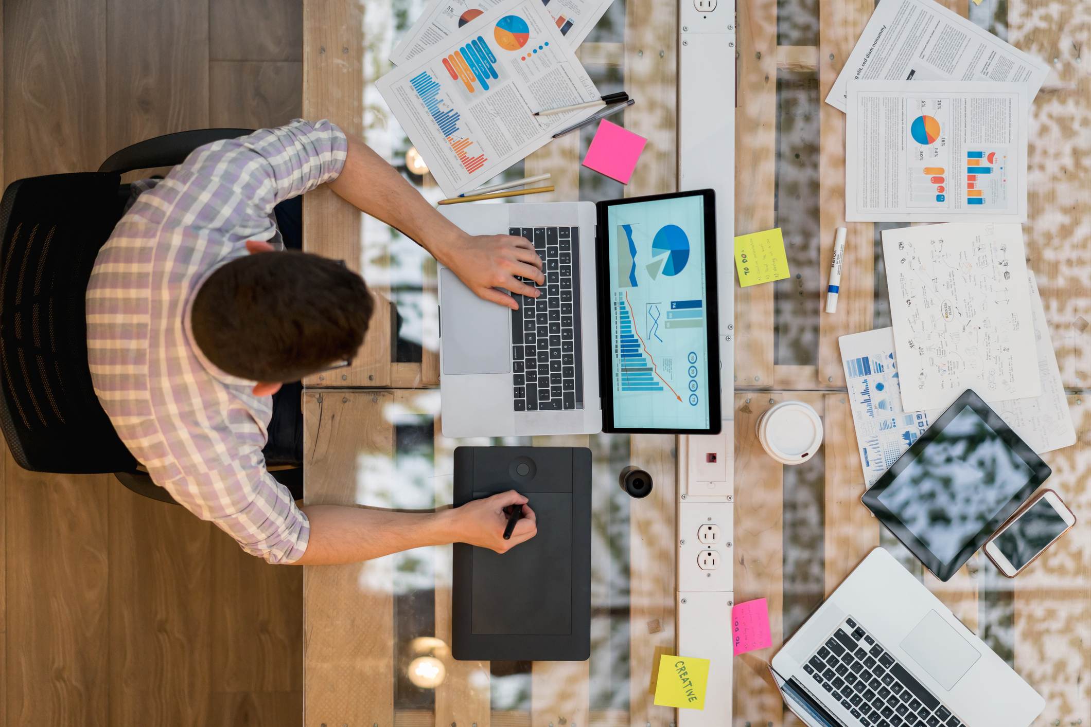 Designer working at a creative office using a laptop computer