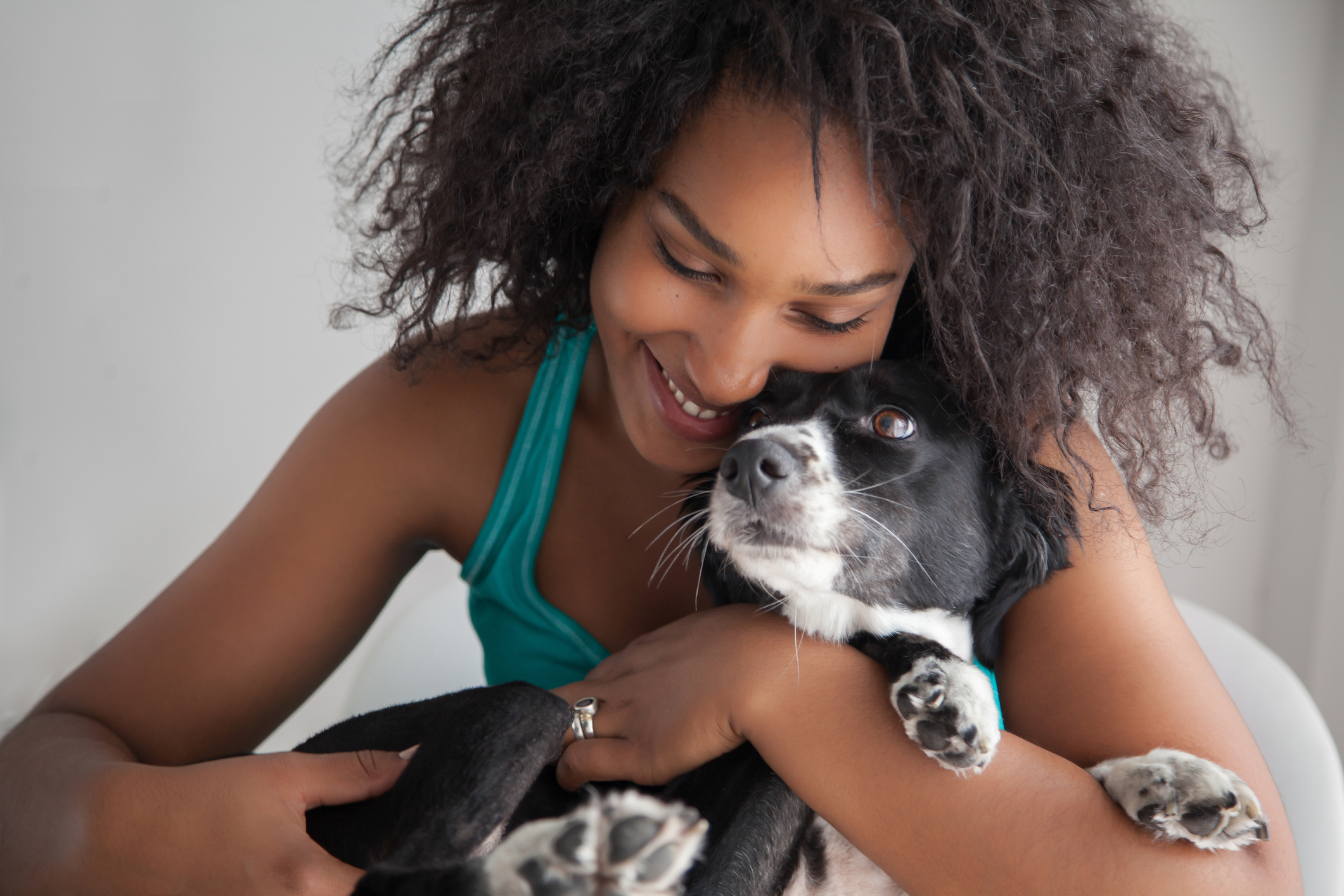 Young woman hugging a dog