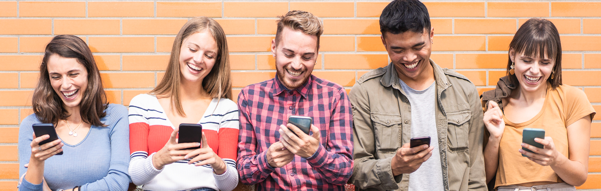 Friends looking at their phone together