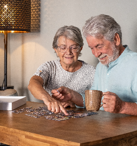 A senior couple playing chess