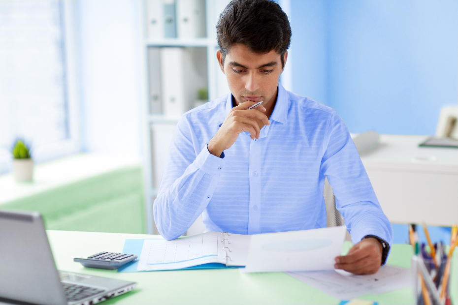 A man looking at documents