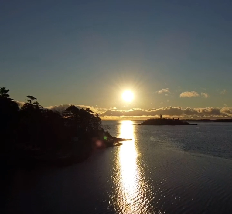 A photograph of the Nova Scotia coast near Lunenburg at sunrise. 