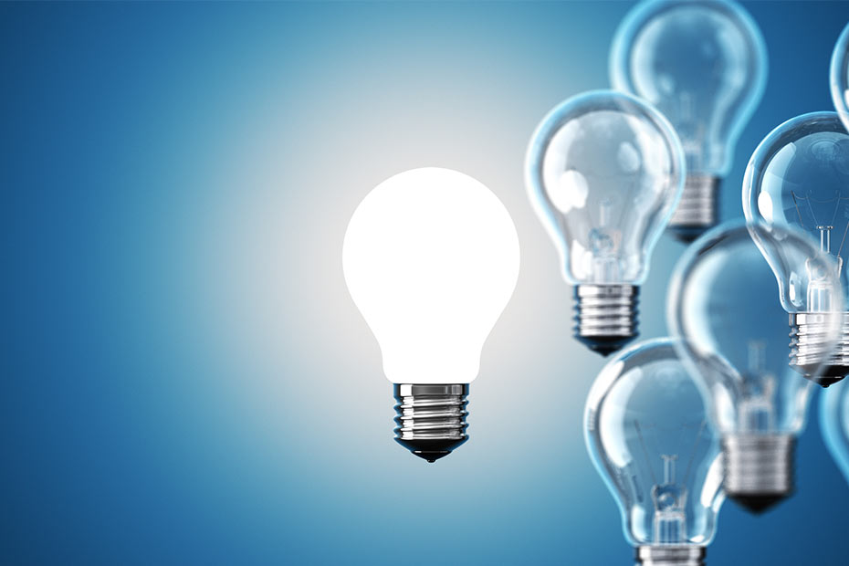 Blue background with a few lightbulbs right justified, with one illuminated bulb in the centre of the page