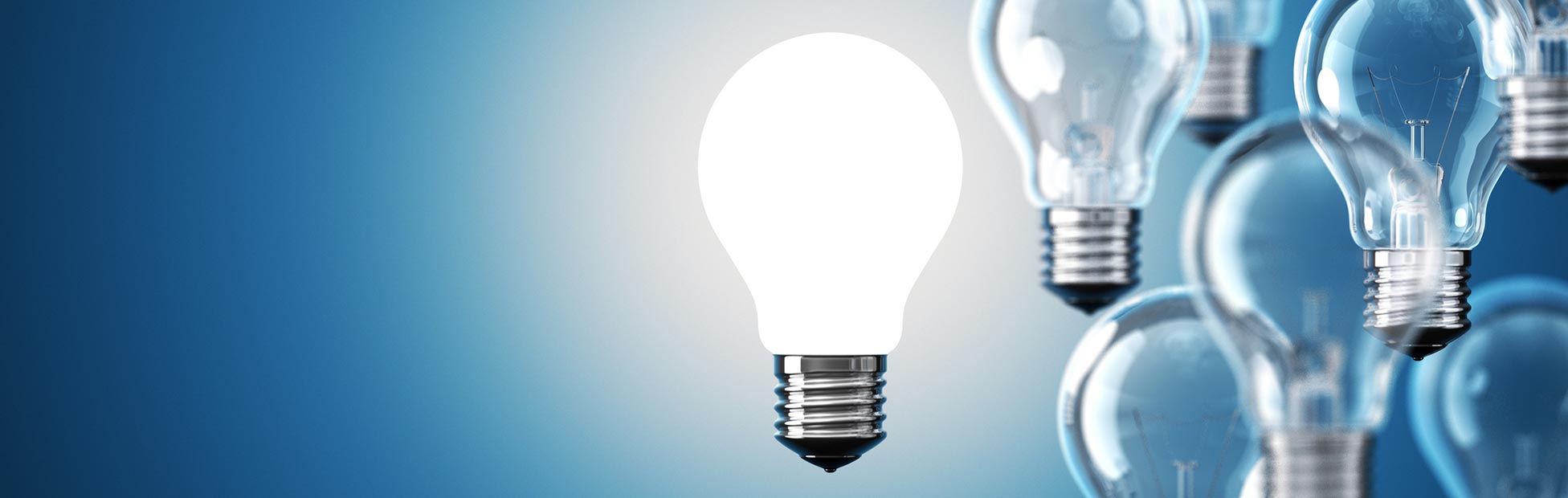Blue background with a few lightbulbs right justified, with one illuminated bulb in the centre of the page